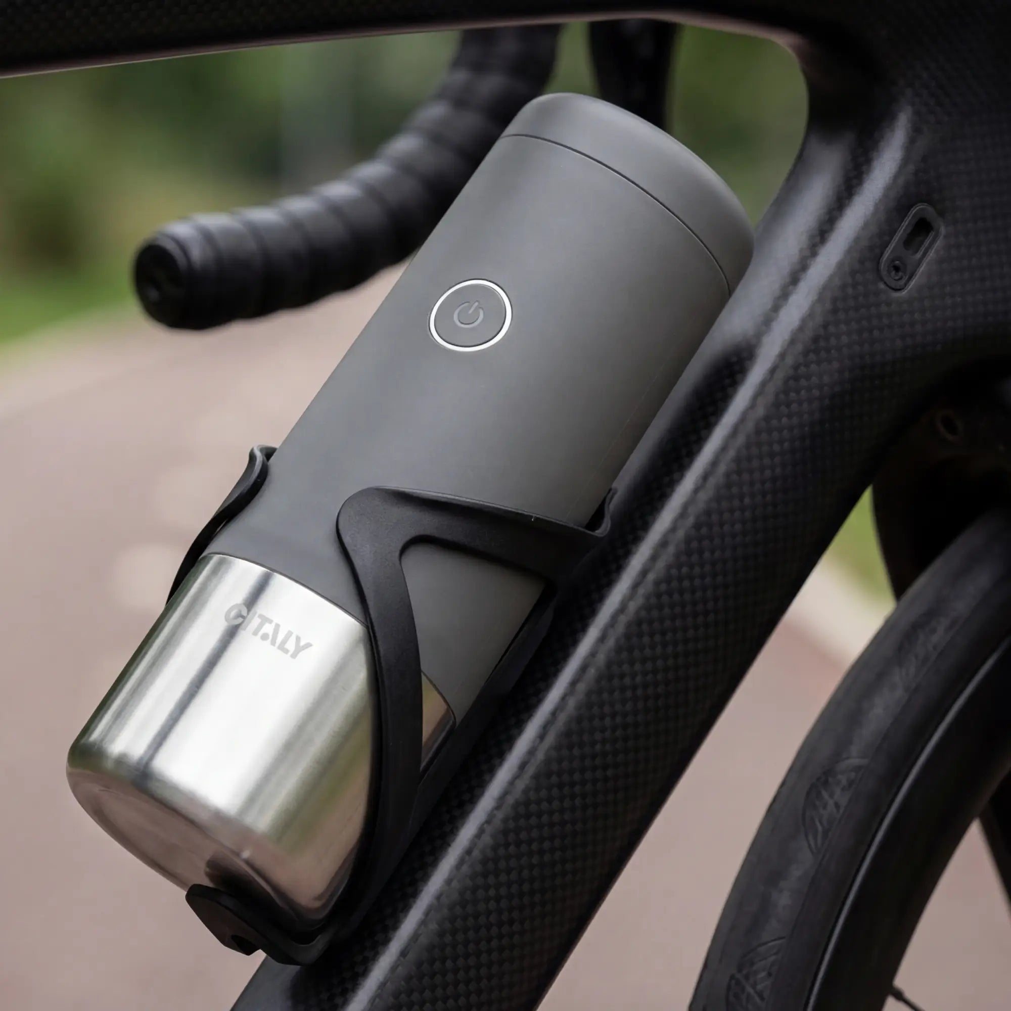 Bicycle water bottle holder with a Citaly GO-1 attached