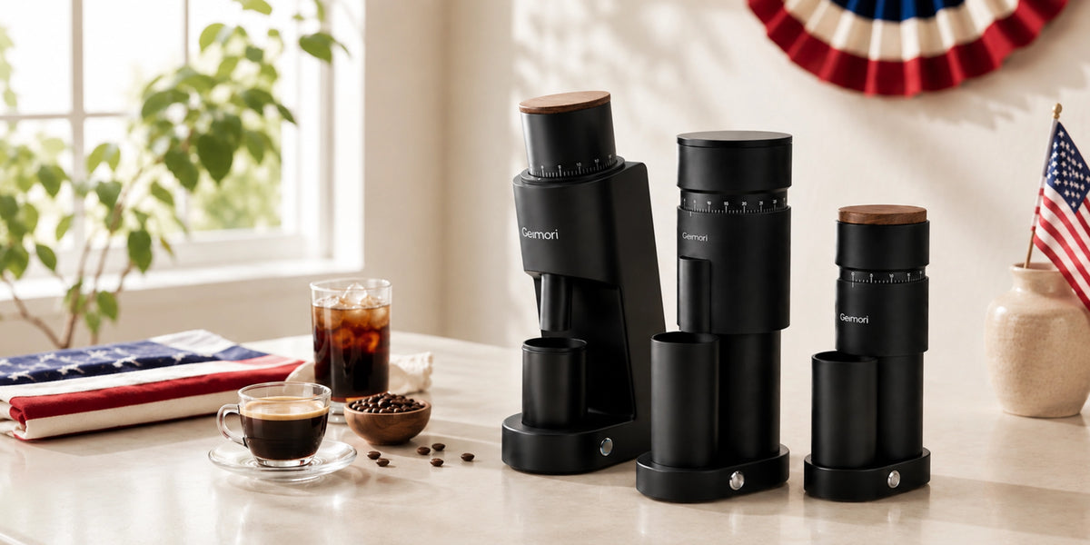 Geimori Coffee Grinders arranged on a light countertop in a bright kitchen setting, alongside coffee cups, beans, and patriotic decor.slider_item_3FJgtJ