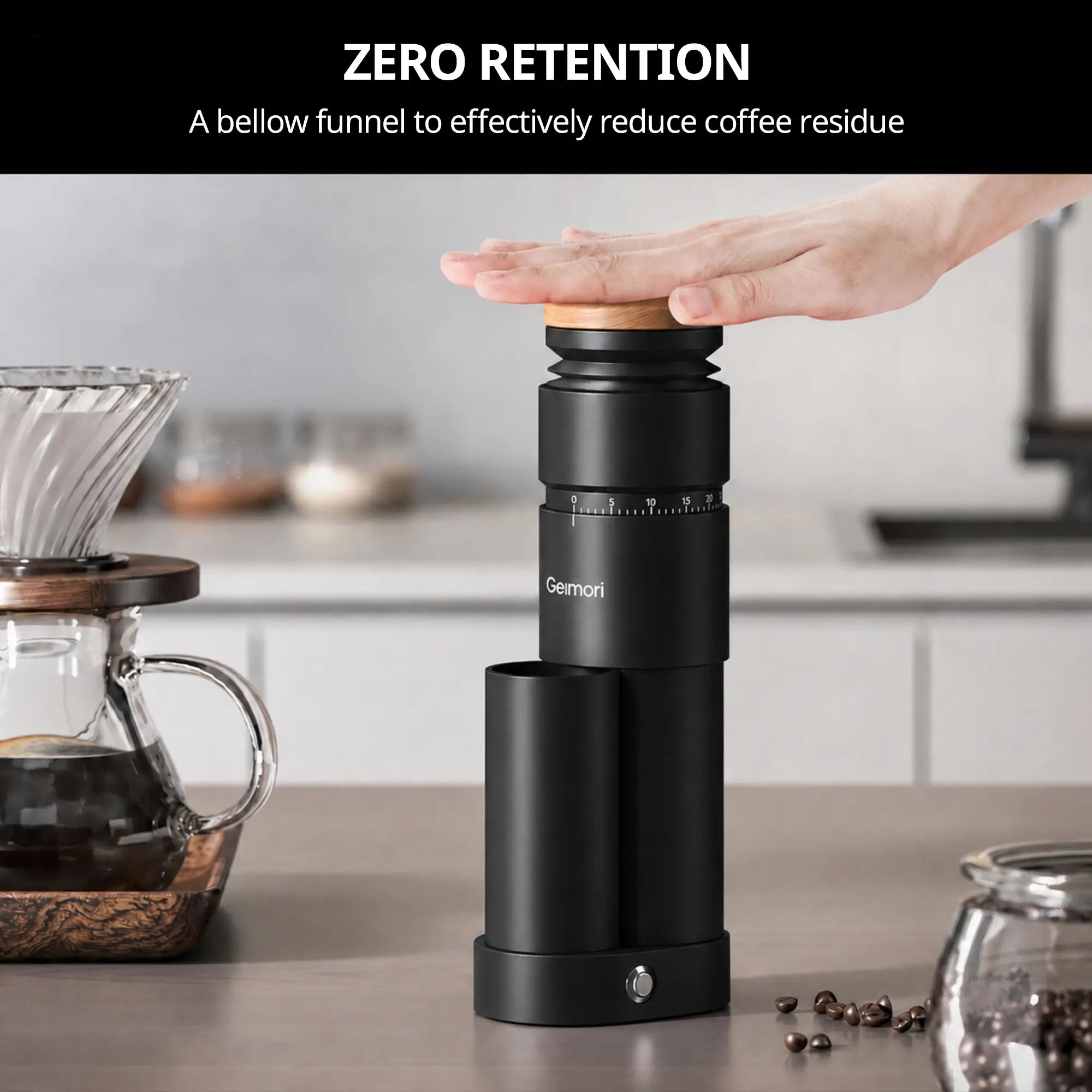 A black Geimori T38 Plus coffee grinder with a wooden lid is shown on a kitchen counter with a hand pressing down on the lid. A text banner at the top reads 'ZERO RETENTION'.